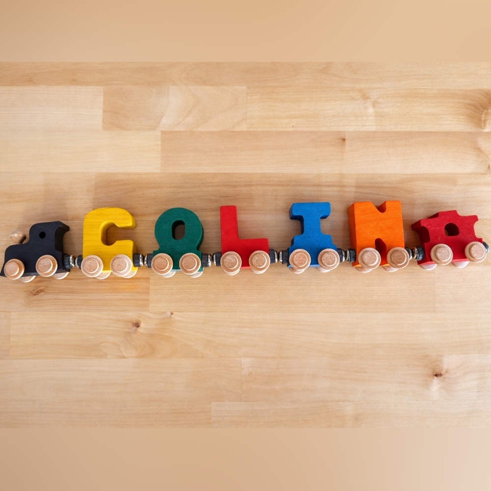 Maple Landmark NameTrain set spelling the name "COLIN".